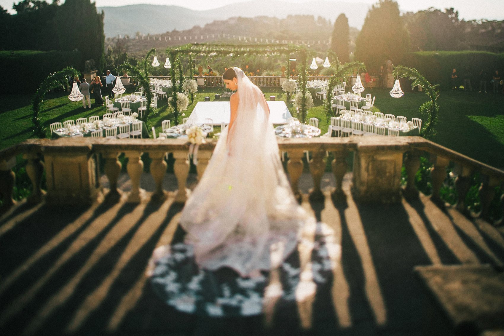 Bride entering a wedding dinner in golden Italian light