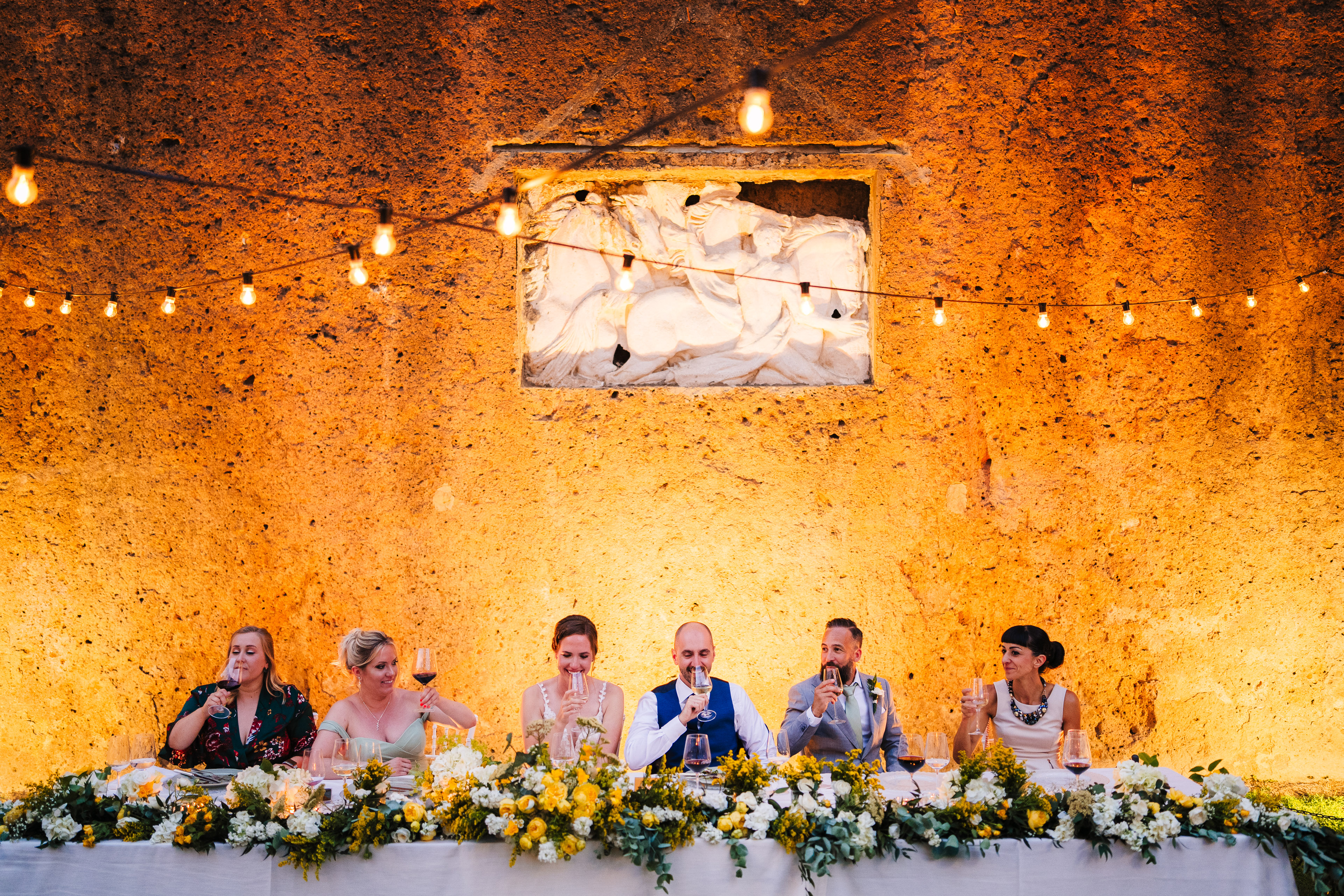 Wedding dinner table under warm lights